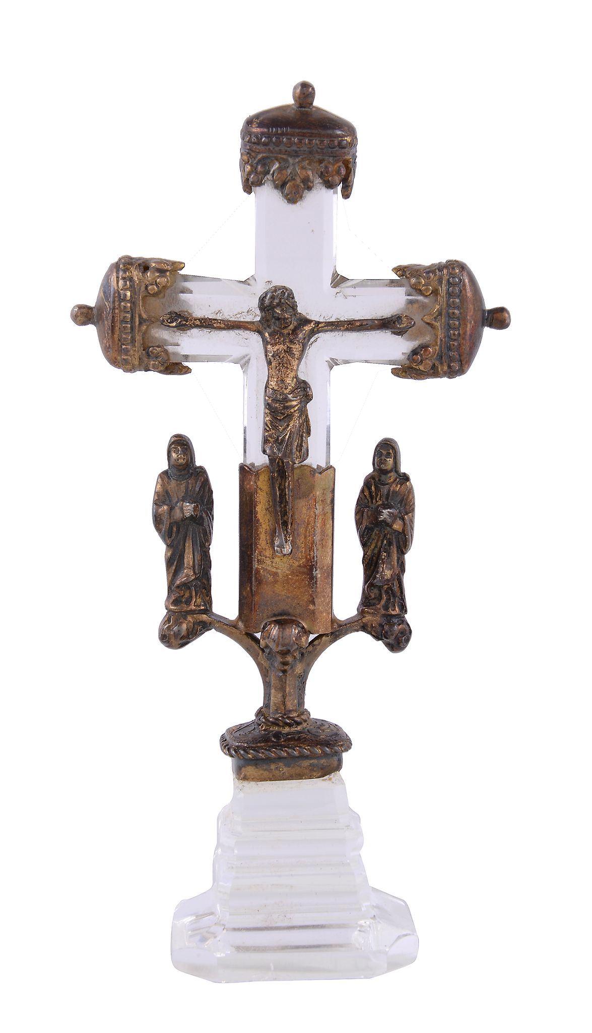 A 20th century clear glass and gilt metal mounted table crucifix, the ends with trefoil and arcaded