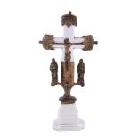 A 20th century clear glass and gilt metal mounted table crucifix, the ends with trefoil and arcaded