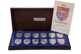 A cased set of twelve silver shield shaped ingots by Yorkshire Mint, Birmingham 1976 and 1977, each