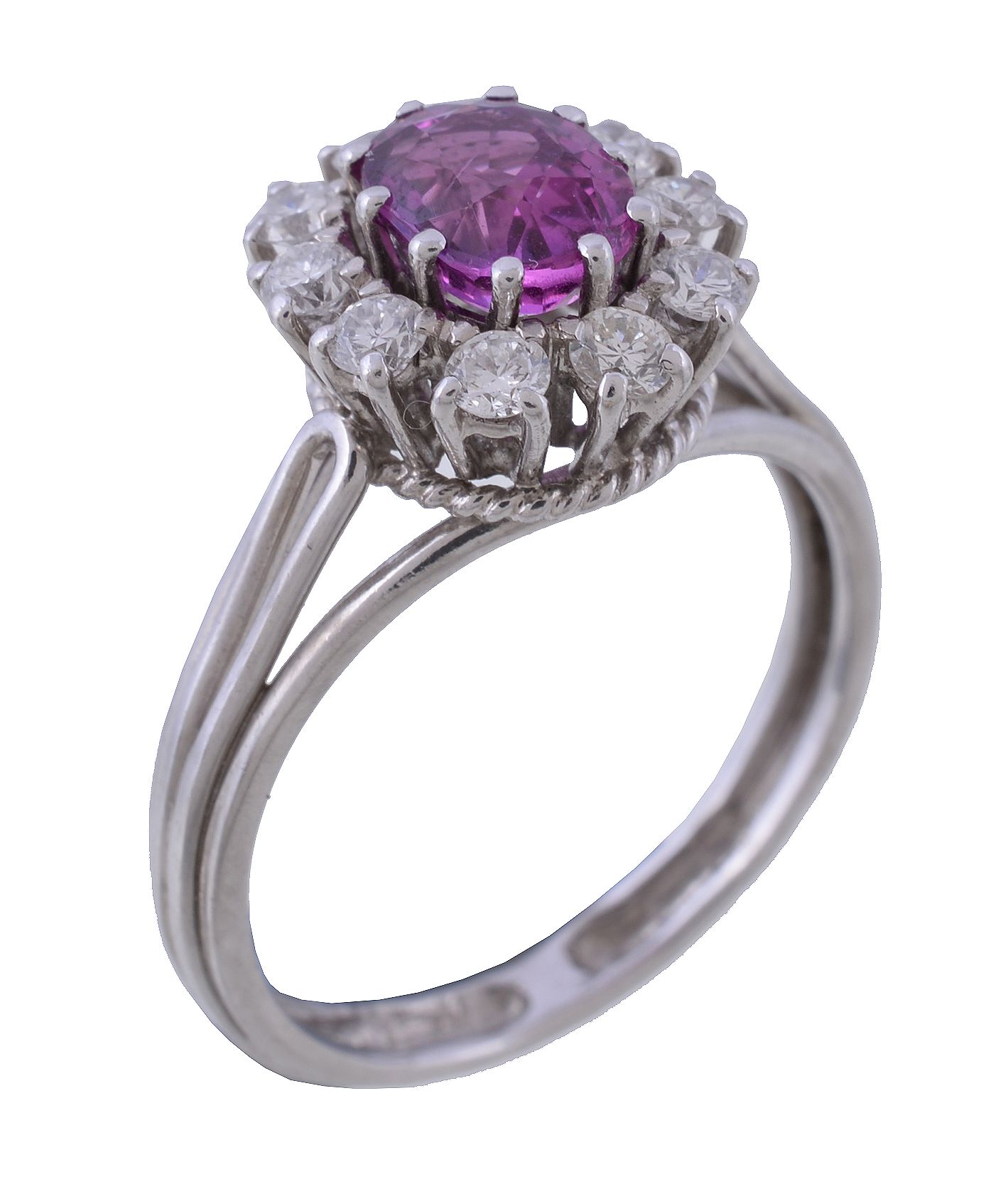 A 1970s pink sapphire and diamond cluster ring, the central oval cut pink sapphire claw set within