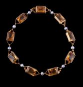 A citrine and seed pearl bracelet, the rectangular cut citrines in collet settings, with seed