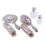 A collection of silver mounted dressing table items, to include: an Edwardian silver mounted hand