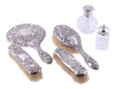 A collection of silver mounted dressing table items, to include: an Edwardian silver mounted hand