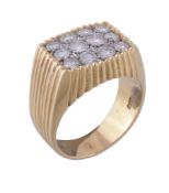 An 18 carat gold diamond ring, set with a panel of brilliant cut diamonds, approximately 1.00