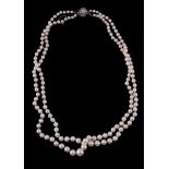 A two row cultured pearl necklace, the two rows of graduating cultured pearls on a knotted string,