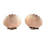 A pair of 1950s shell clip brooches, designed as scallop shells, with double prong clip fittings,