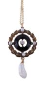 An early 20th century diamond, seed pearl and onyx pendant, the central old brilliant cut diamond