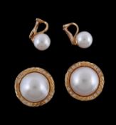 A pair of mabe pearl and diamond earrings, the mabe pearl within a twisting surround set with