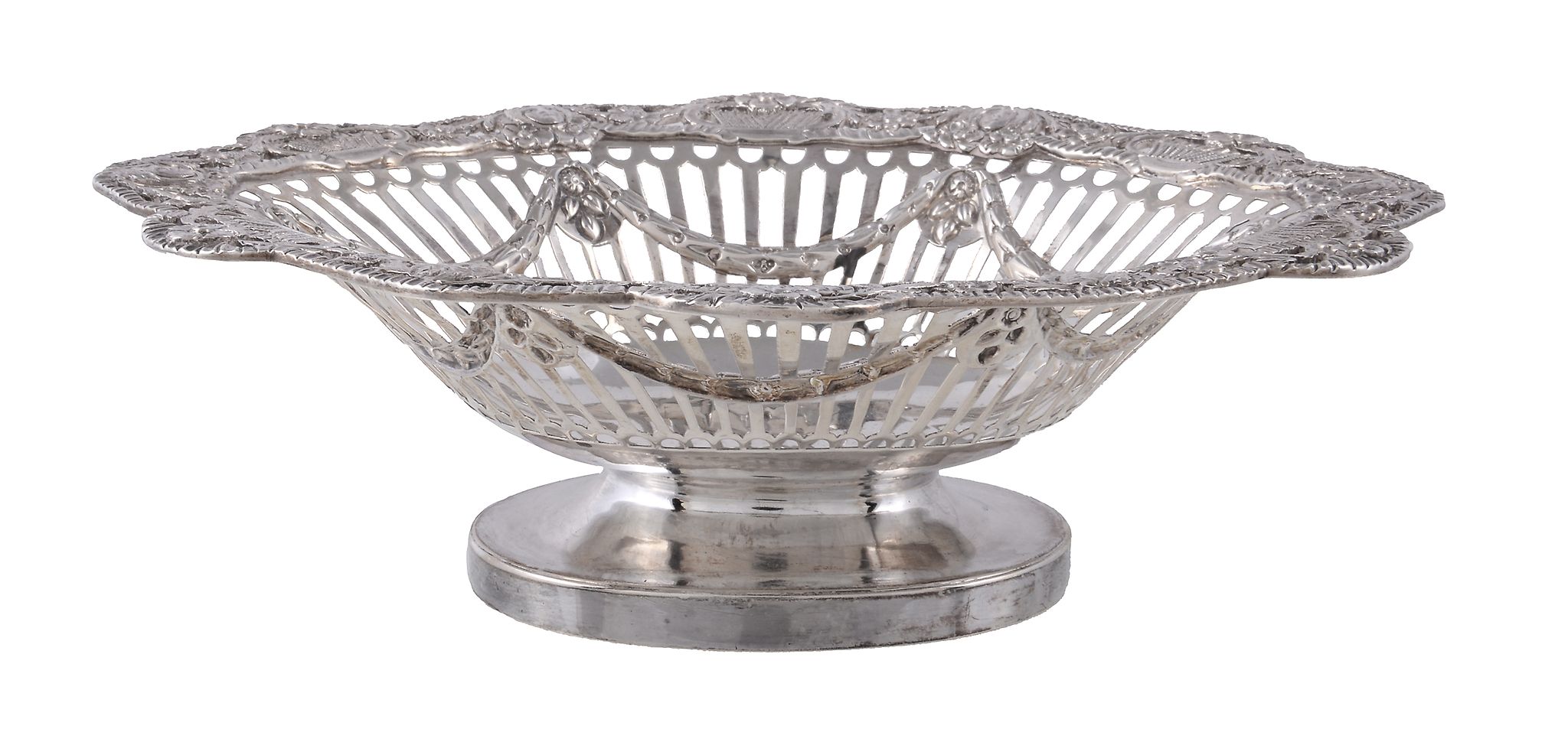 A late Victorian silver shaped oval pedestal basket by Charles Stuart Harris, London 1898, the