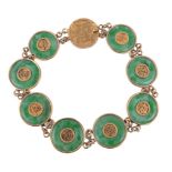 A 1920's Chinese export jadeite jade panel bracelet by Wang Hing, the circular jadeite jade discs