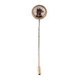 A reverse crystal intaglio Manchester Terrier stick pin, the circular panel carved and painted with