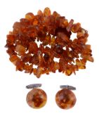 A two row amber bead necklace, composed of graduated tumbled amber beads, 41.5cm long; together