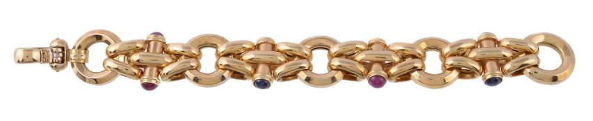 An 18 carat gold ruby and sapphire bracelet, the hollow links with polished batons set with