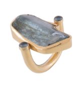A blue tourmaline ring by Elena Votsi, the blue tourmaline panel in a swivel collet setting,