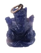 A sapphire Ganesh pendant, the sapphire carved as Ganesh, 3.4cm long including bale