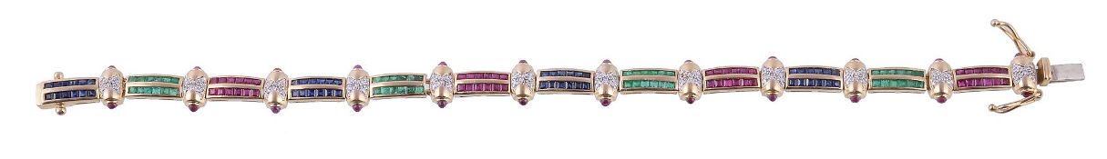 A multi gem set bracelet, with alternating panels channel set with rubies, emeralds or sapphires,