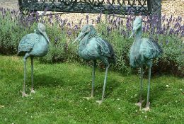 Three bronze alloy garden models of storks, circa 2000, modeled as standing Three bronze alloy