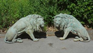 A pair of bronze alloy garden models of male lions, circa 2000 A pair of bronze alloy garden