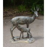 A bronze alloy garden group of a springbok doe and a fawn, circa 2000 A bronze alloy garden group of