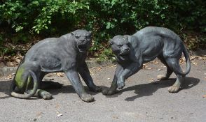 A pair of bronze alloy garden models of panthers, circa 2000 A pair of bronze alloy garden models of