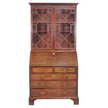 A George III mahogany bureau bookcase , second half 18th century, the astragal doors enclosing