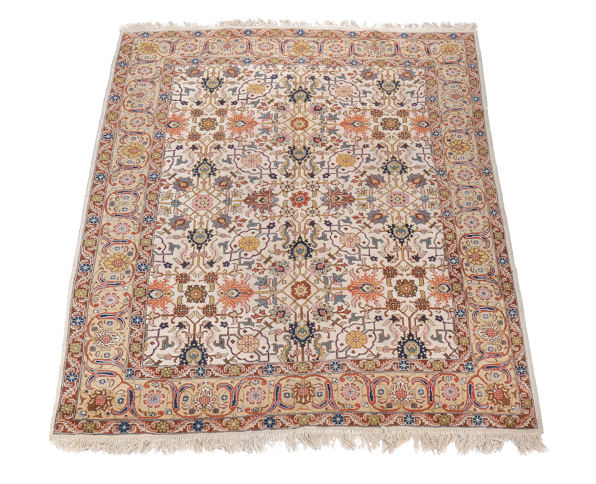 A Tabriz carpet, the cream field profusely decorated with flowerheads and foliage in polychrome,
