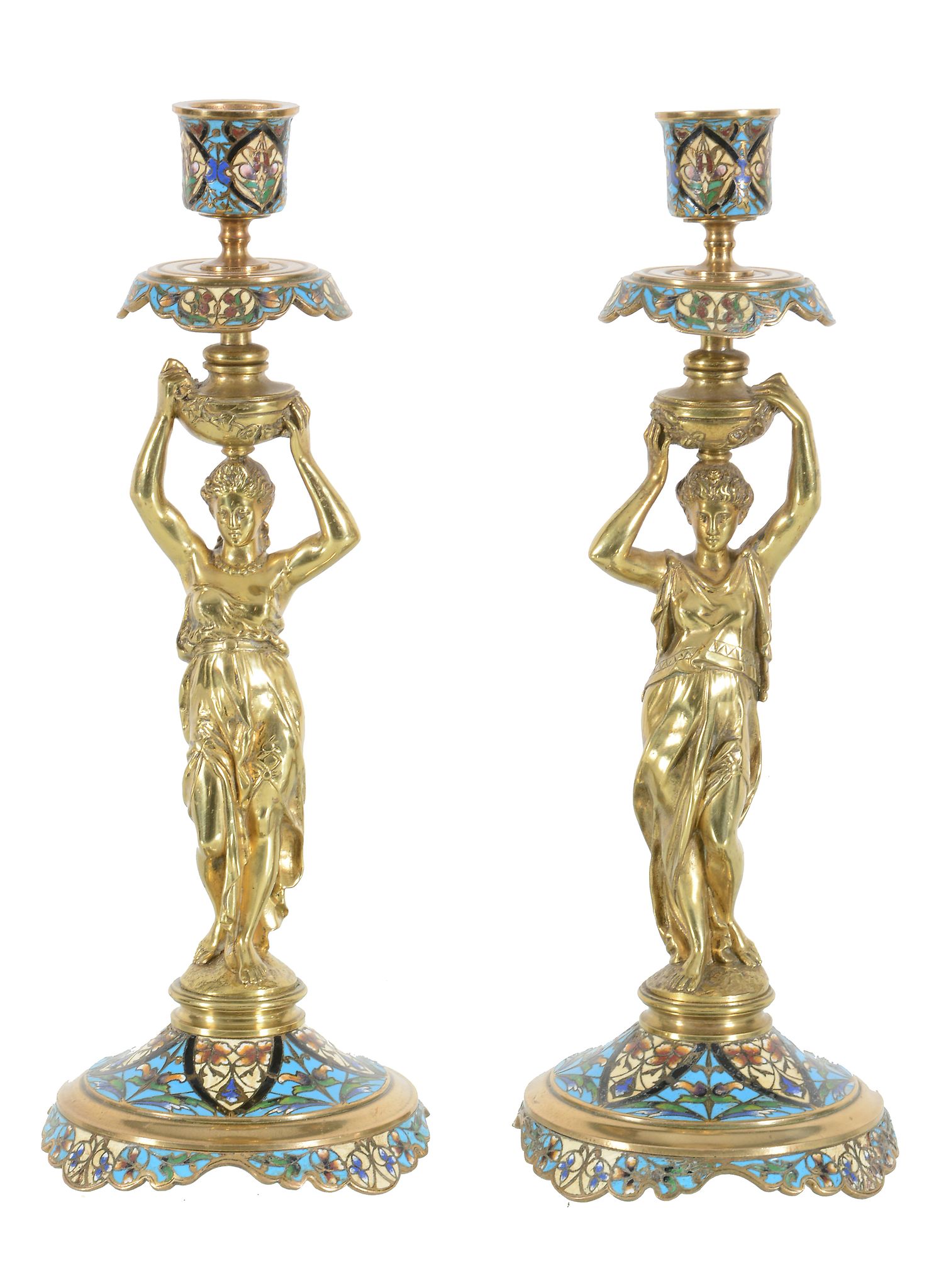 A pair of French gilt bronze and champleve enamel figural candlesticks, circa 1880, probably