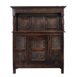 A Charles II panelled oak press cupboard, Westmorland, circa 1660, the moulded cornice above the