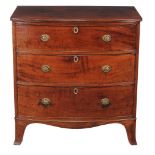 A George III mahogany bowfront chest of drawers, circa 1800, the brushing slide above three long