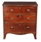 A George III mahogany bowfront chest of drawers, circa 1800, the brushing slide above three long