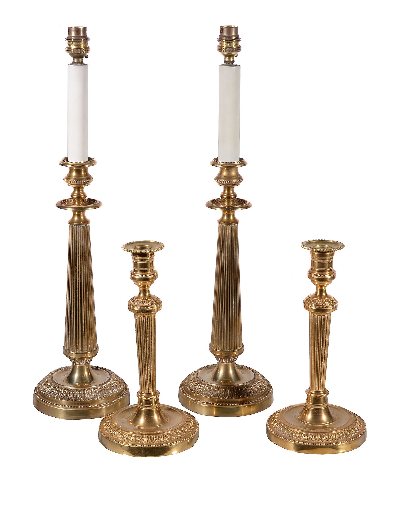 A pair of gilt metal table lamps modelled as early 19th century candlesticks, second half 20th