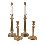 A pair of gilt metal table lamps modelled as early 19th century candlesticks, second half 20th