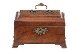 A George II mahogany tea caddy, mid 18th century, the hinged and cavetto edged cover with foliate