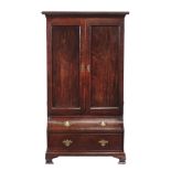 A mahogany cupboard , circa 1770 and later, the panel doors enclosing an arrangement of shelves, on