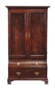 A mahogany cupboard , circa 1770 and later, the panel doors enclosing an arrangement of shelves, on