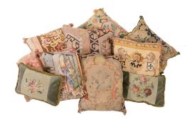 A collection of eight cushions , including one with antique tapestry fragment, the others with