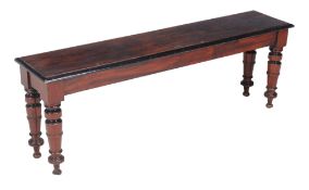 A Victorian mahogany and parcel ebonised hall bench or window seat , circa 1880, 47cm high, 137cm