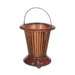 An Edwardian mahogany and copper lined jardiniere , circa 1905, of tapered cylindrical form, with