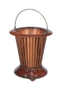 An Edwardian mahogany and copper lined jardiniere , circa 1905, of tapered cylindrical form, with