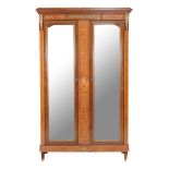 A French mahogany and inlaid armoire or wardrobe , early 20th century, the pair of mirror panelled