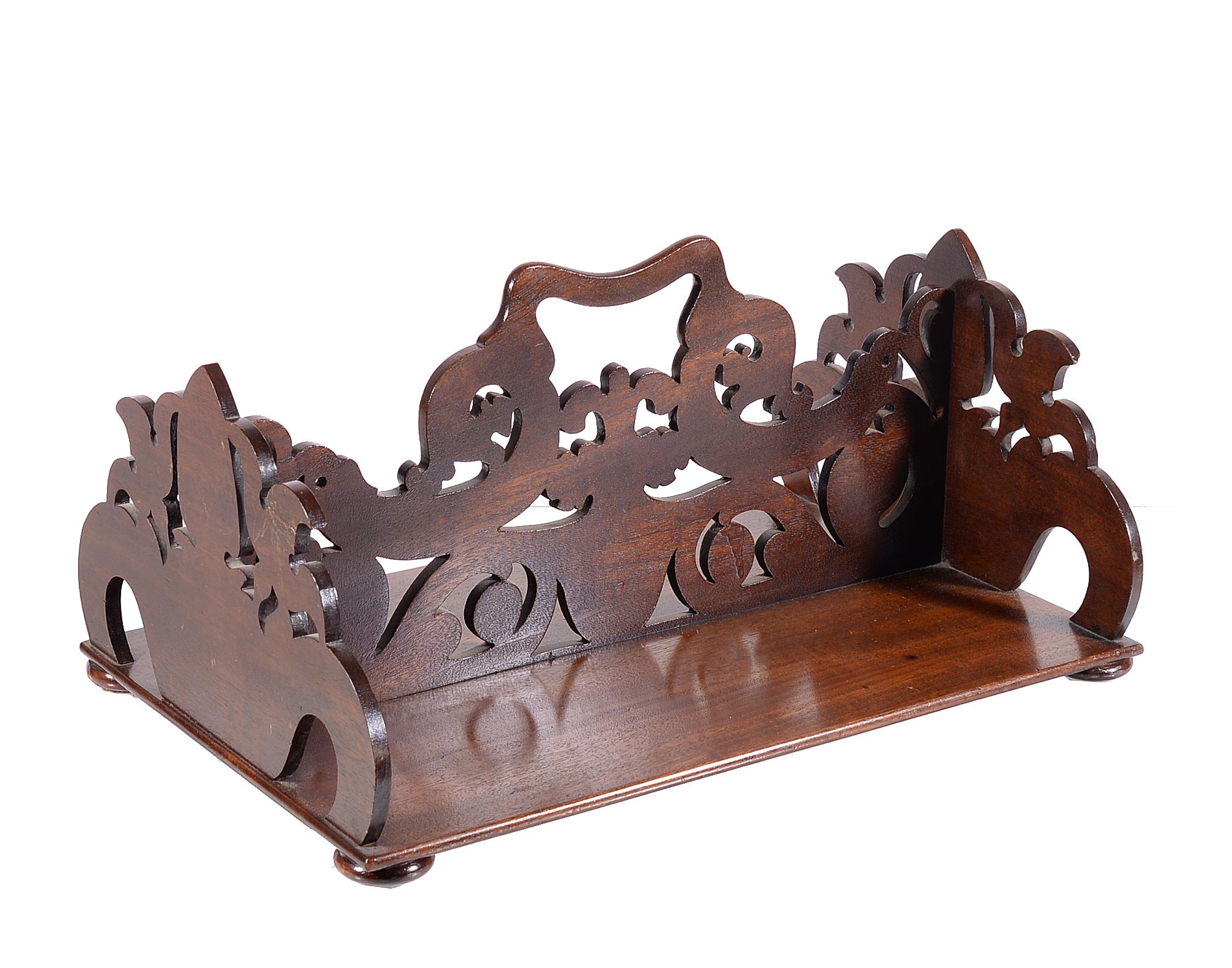 An early Victorian carved mahogany double sided bookstand, mid 19th century, the central division