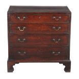 A George III mahogany chest of drawers, circa 1800, with crossbanded and string inlaid top, set