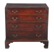 A George III mahogany chest of drawers, circa 1800, with crossbanded and string inlaid top, set