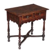 A Queen Anne burr walnut and inlaid side table, circa 1710, the pair of holly banded frieze drawers