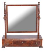 A Regency mahogany and inlaid dressing mirror , circa 1815, the plinth base incorporating three