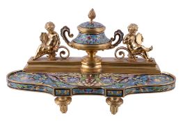 A French gilt metal and champleve enamel encrier, circa 1880, the inkwell modelled as a twin
