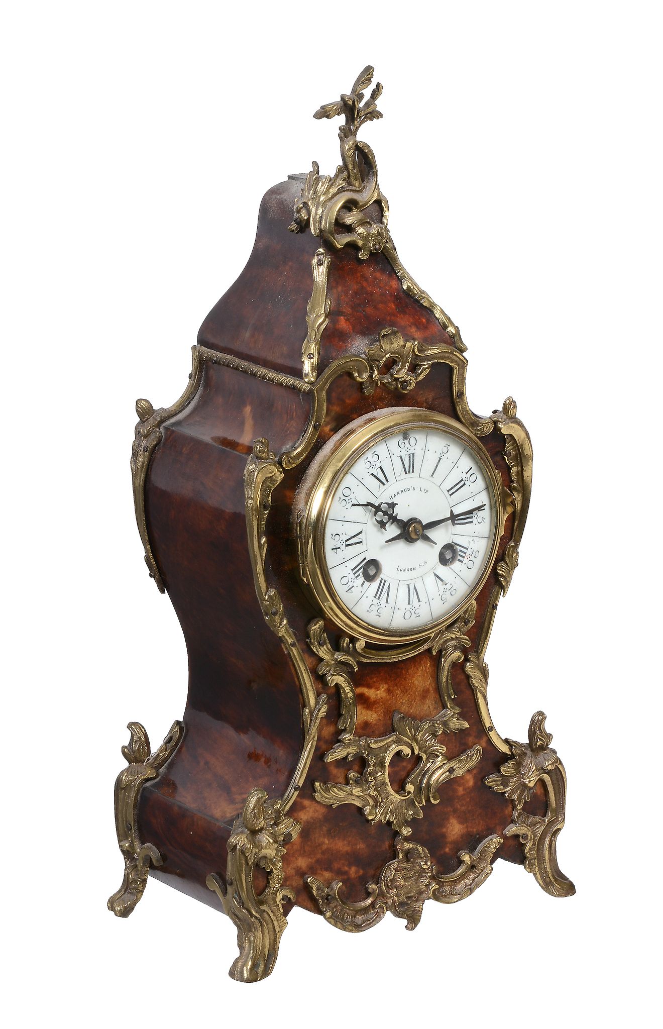 Ω A French gilt brass mounted tortoiseshell veneered mantel clock in the Louis XV taste, retailed by