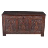 A carved oak and inlaid triple panel coffer , circa 1690, the three panels each centred by a flower