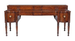 A Scottish George IV mahogany sideboard, circa 1820, the stage back with sliding panels concealing