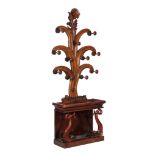 A Victorian mahogany hall stand , circa 1860, with dolphin supports to the stick stand, 243cm high,